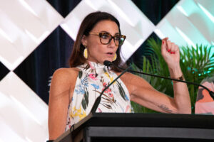 Kim Bode speaks at a conference.